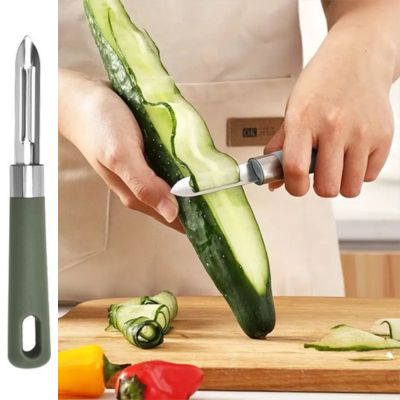 Économe couteau vert
