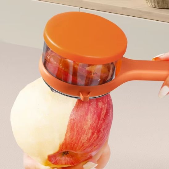 Éplucheur à légumes avec réservoir pèle une pomme