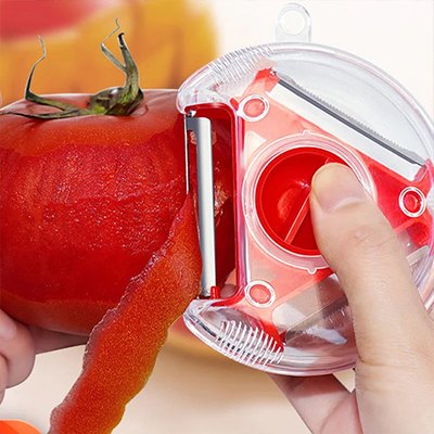 Éplucheur à légumes triple lames pèle une tomate