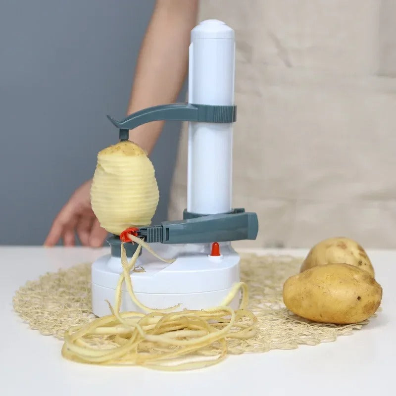 Eplucheur electrique pèle une pomme de terre