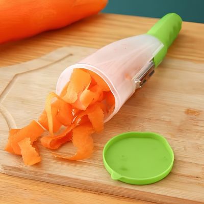 Éplucheuse légumes avec réservoir rempli de pelures