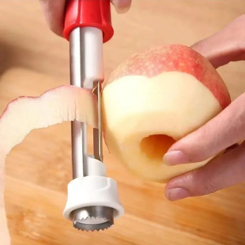 Vide pomme à manche rouge pèle une pomme